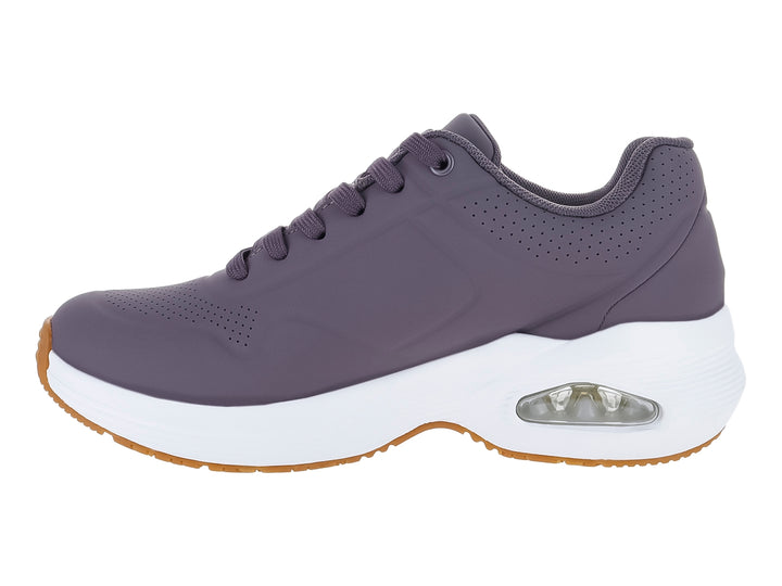 Tenis Flexi color lila con suela blanca y detalle de cámara de aire en el talón.