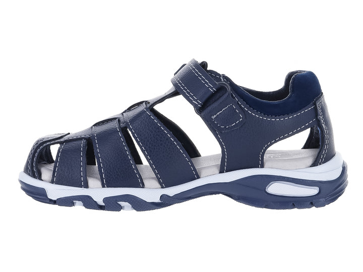 Sandalias New Boys color azul marino con suela blanca y cierre de velcro para niño.