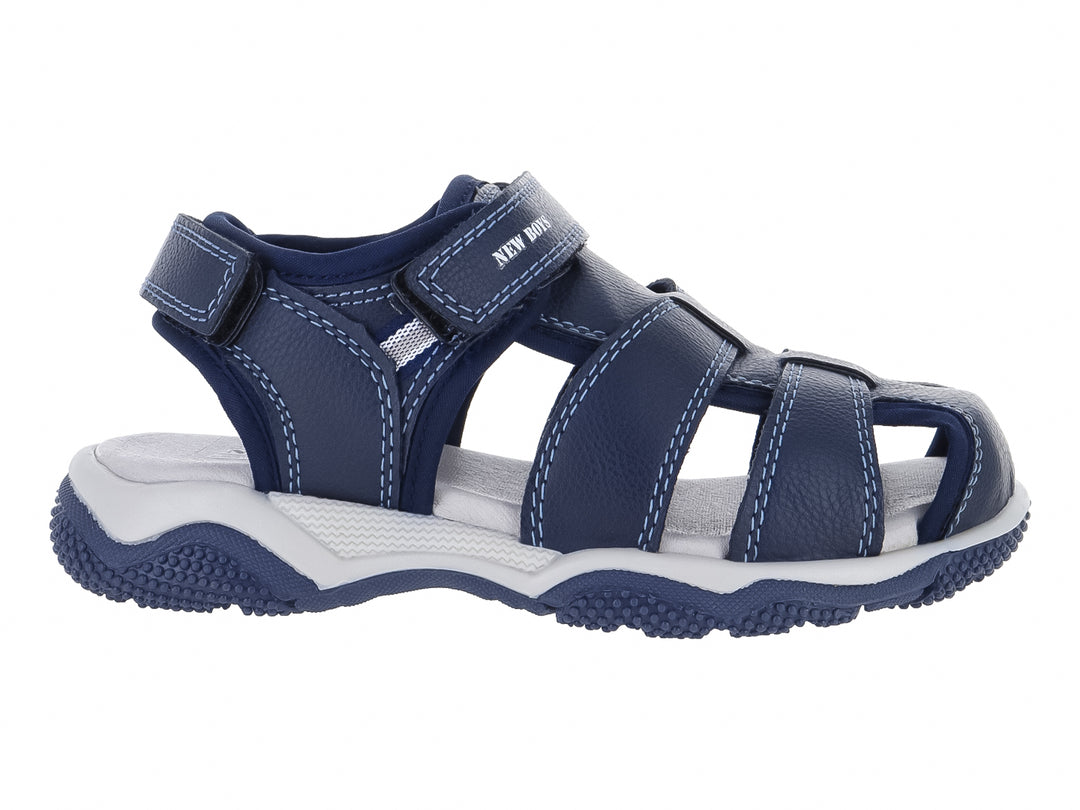 Sandalia para niño color azul marino con correas de velcro y suela blanca.