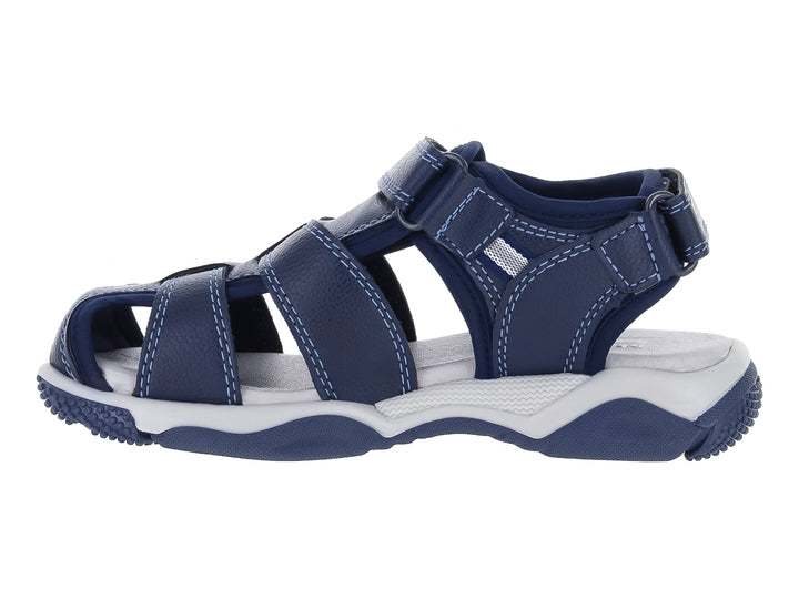 Sandalia para niño color azul marino con suela blanca y correas de cierre con velcro.