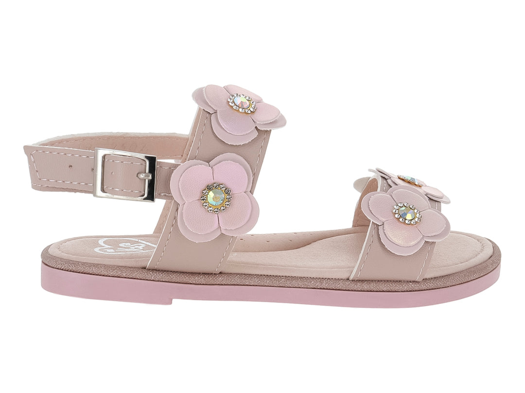Sandalias color maquillaje para niña con adornos de flores en relieve y detalles brillantes.