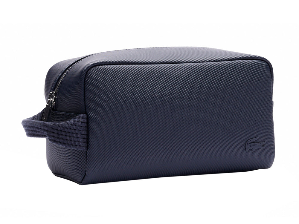 Estuche organizador Lacoste color navy con asa lateral y cierre superior.