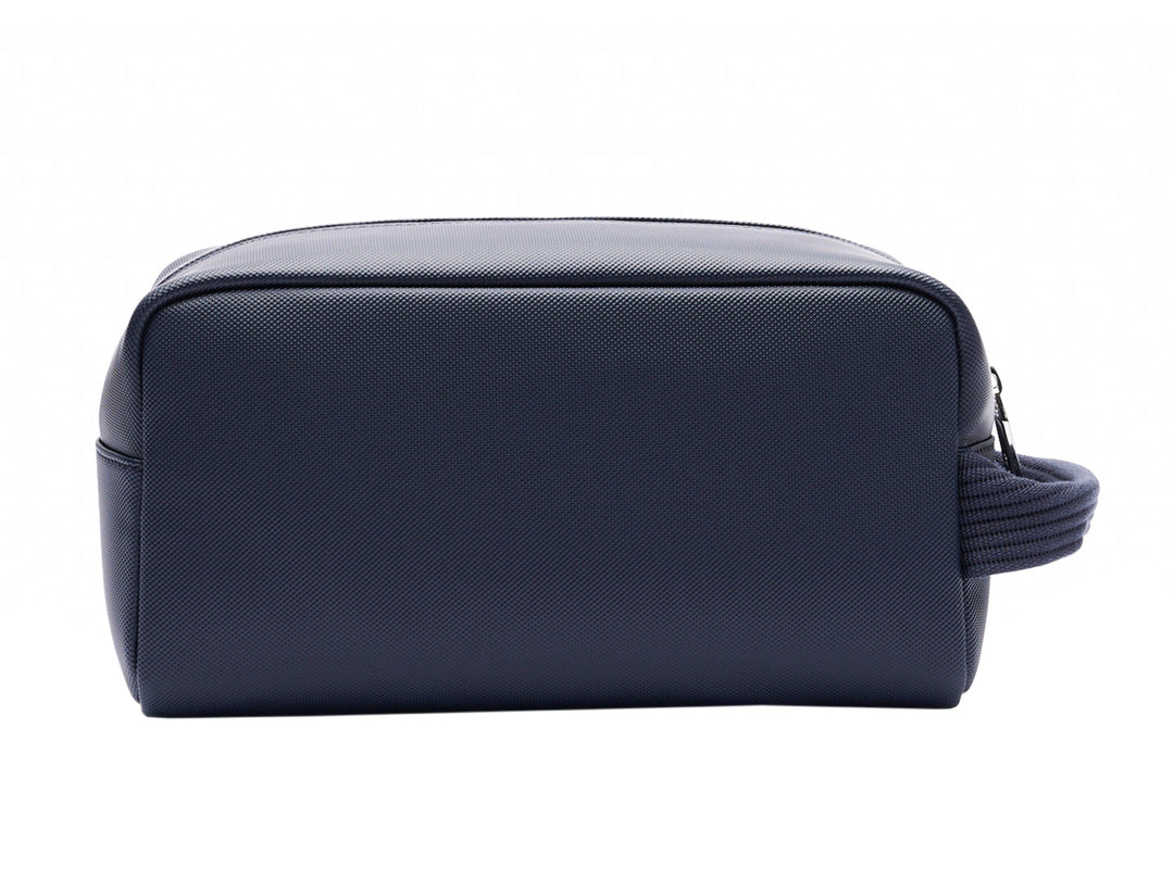 Estuche organizador Lacoste color navy con asa lateral y cierre superior.