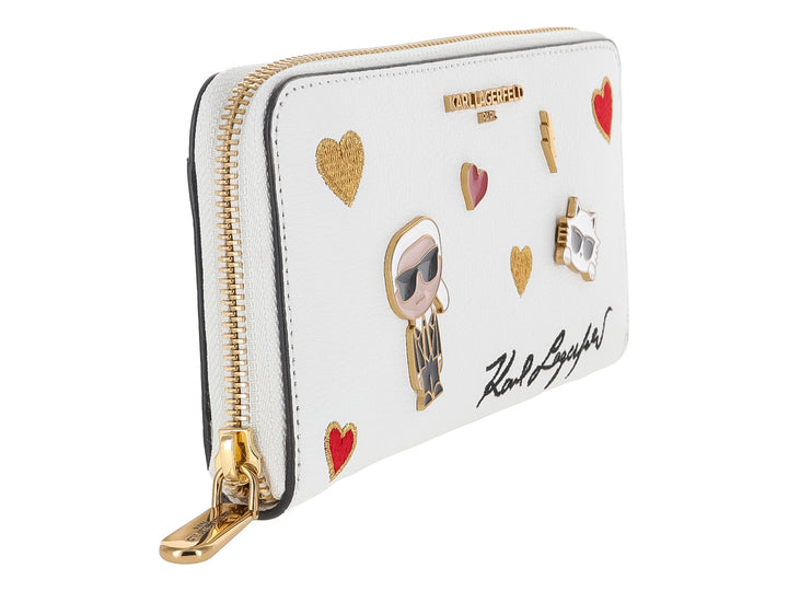 Cartera blanca de Karl Lagerfeld con parches decorativos de corazones, figuras y firma en negro.