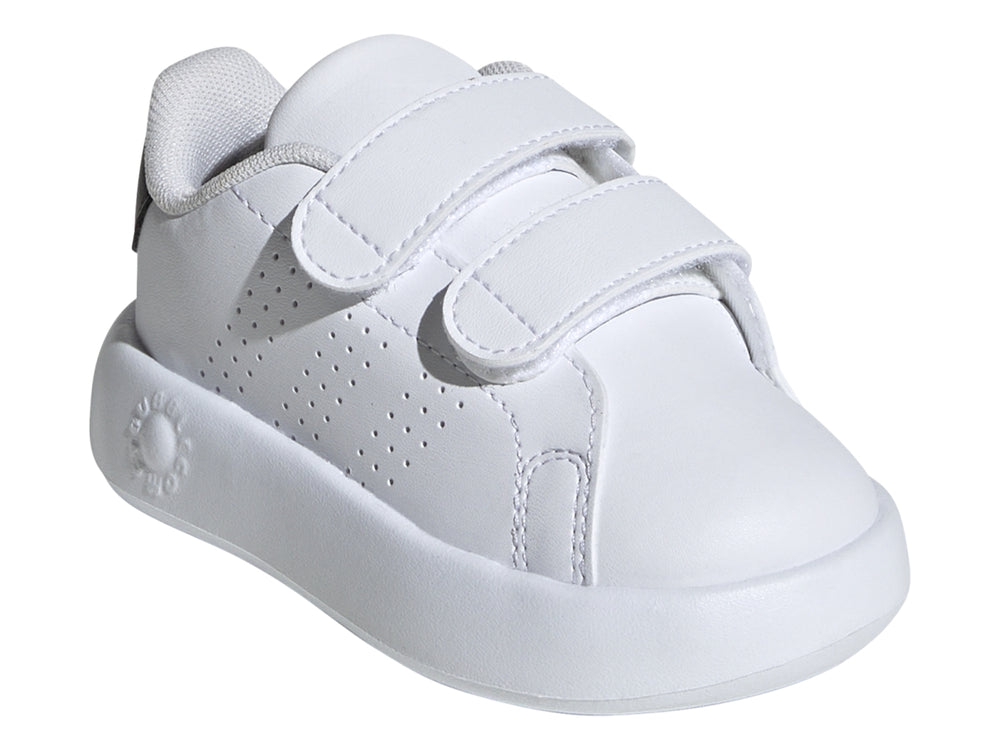Tenis Adidas blancos para Niño con cierre de velcro y detalle negro en el talón.