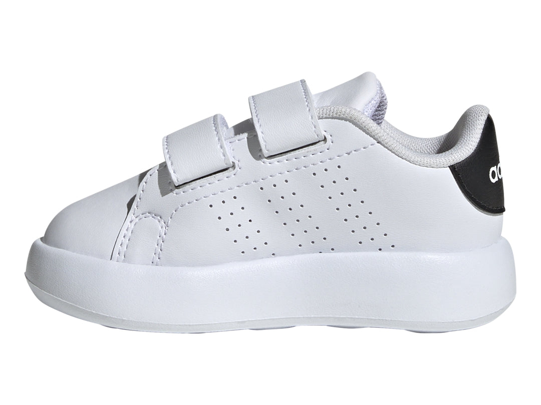 Tenis Adidas blancos para Niño con cierre de velcro y detalle negro en el talón.