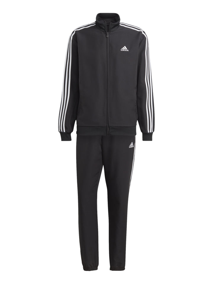 Conjunto deportivo Adidas negro con tres franjas blancas laterales compuesto por chaqueta y pantalón.