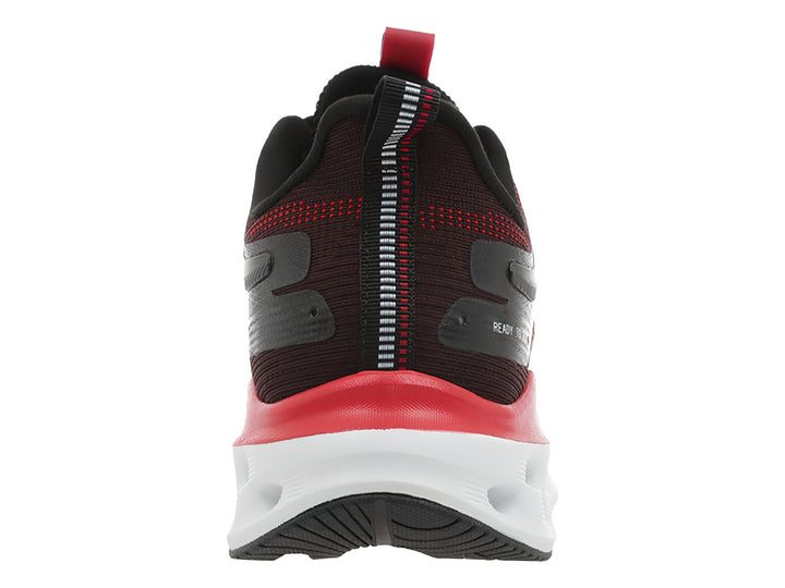 Tenis deportivos K-Swiss Atreux en colores negro y rojo con suela blanca robusta.