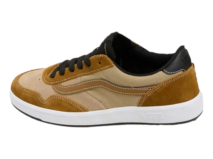 Tenis VANS color marrón bronce con detalles en beige, cordones negros y suela blanca.