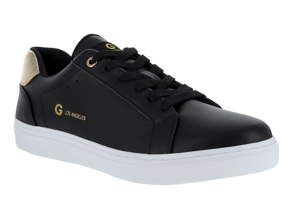Tenis negros de cuero con detalle dorado en el talón y suela blanca.