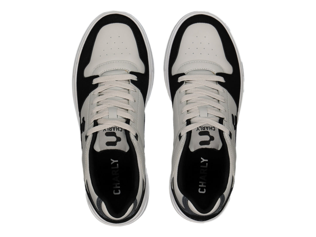 Tenis deportivos Charly en colores gris, negro y blanco con suela blanca y base café.