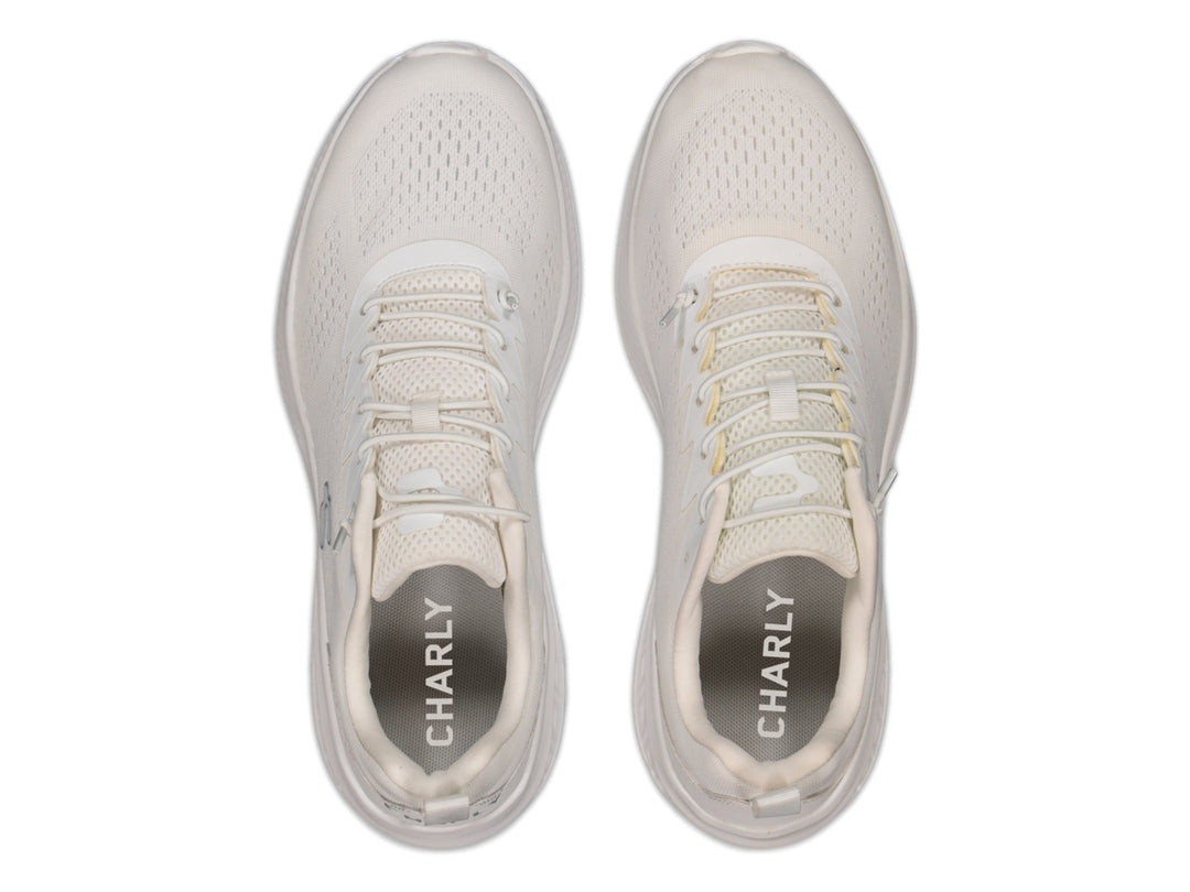Tenis deportivos Charly color blanco con malla transpirable y suela blanca.