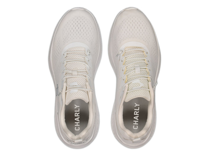 Tenis deportivos Charly color blanco con malla transpirable y suela blanca.