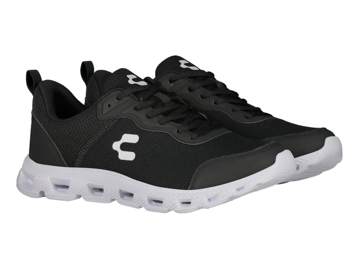 Tenis deportivos Charly color negro con suela blanca y logotipo blanco lateral.