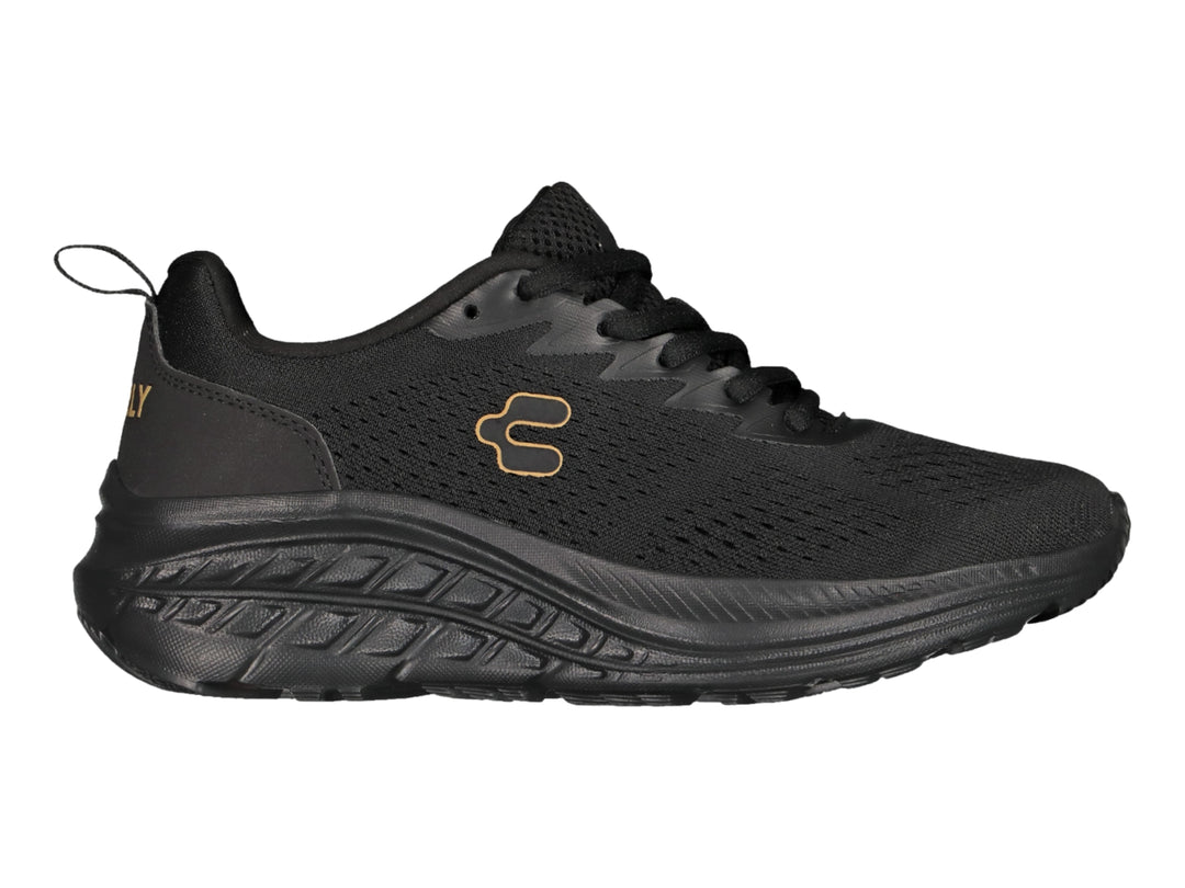Tenis deportivos Charly de color negro con suela gruesa y tejido transpirable.