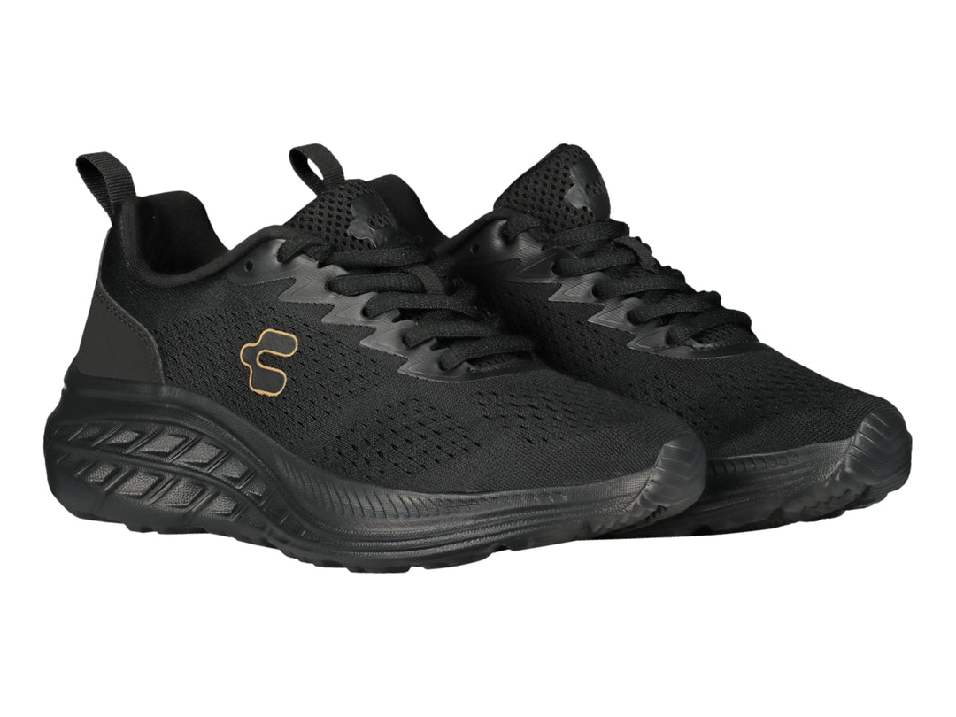 Tenis deportivos Charly de color negro con suela gruesa y tejido transpirable.