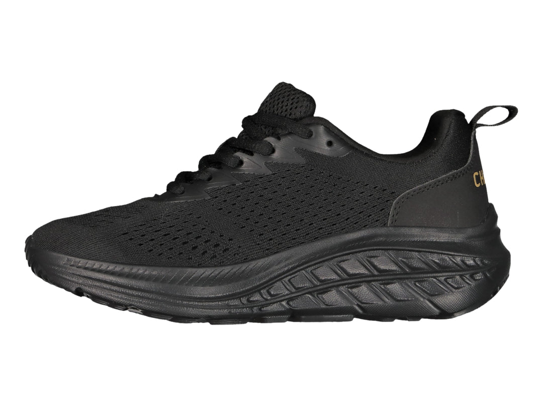 Tenis deportivos Charly de color negro con suela gruesa y tejido transpirable.