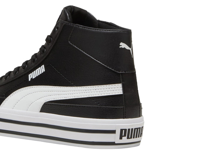 Tenis PUMA de corte alto en color negro con suela blanca.