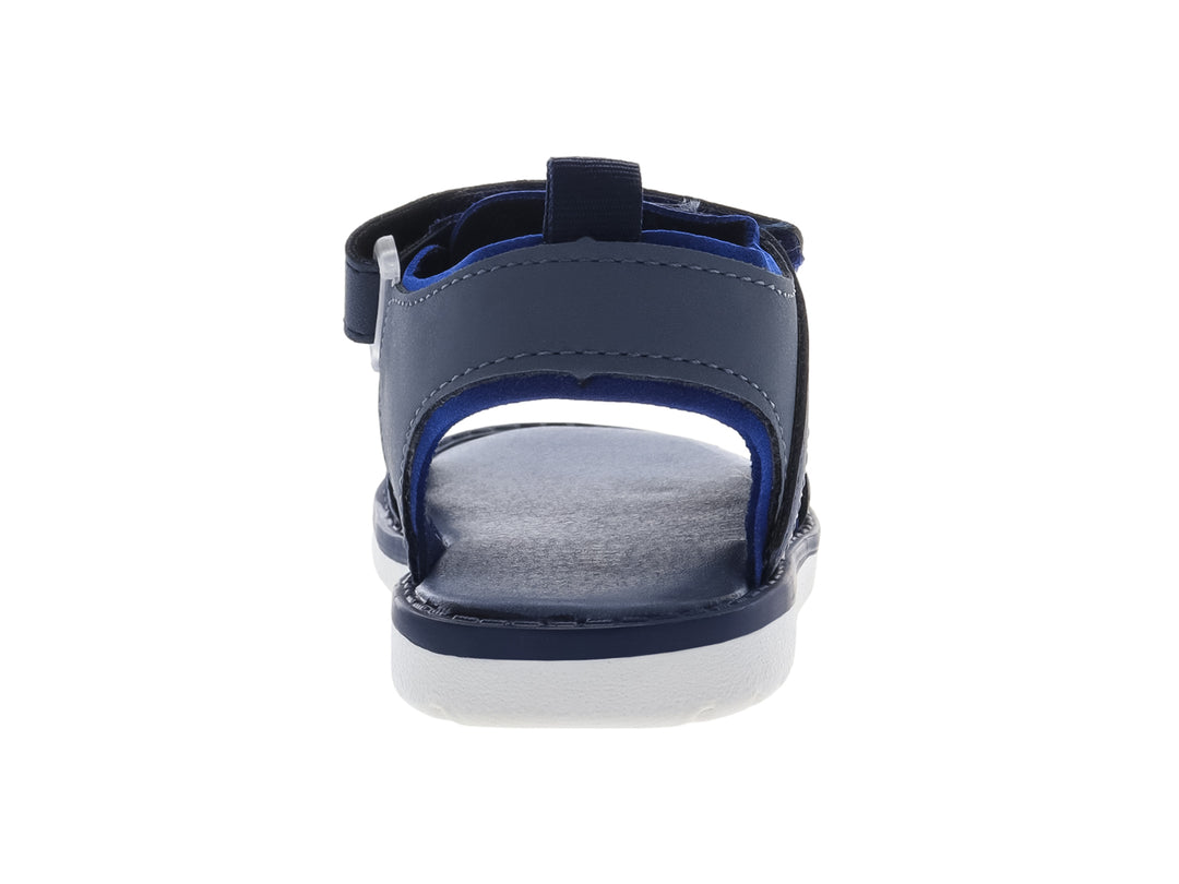 Sandalia infantil color azul marino con suela blanca y correas de ajuste con velcro.