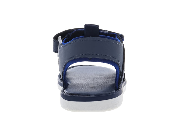 Sandalia infantil color azul marino con suela blanca y correas de ajuste con velcro.