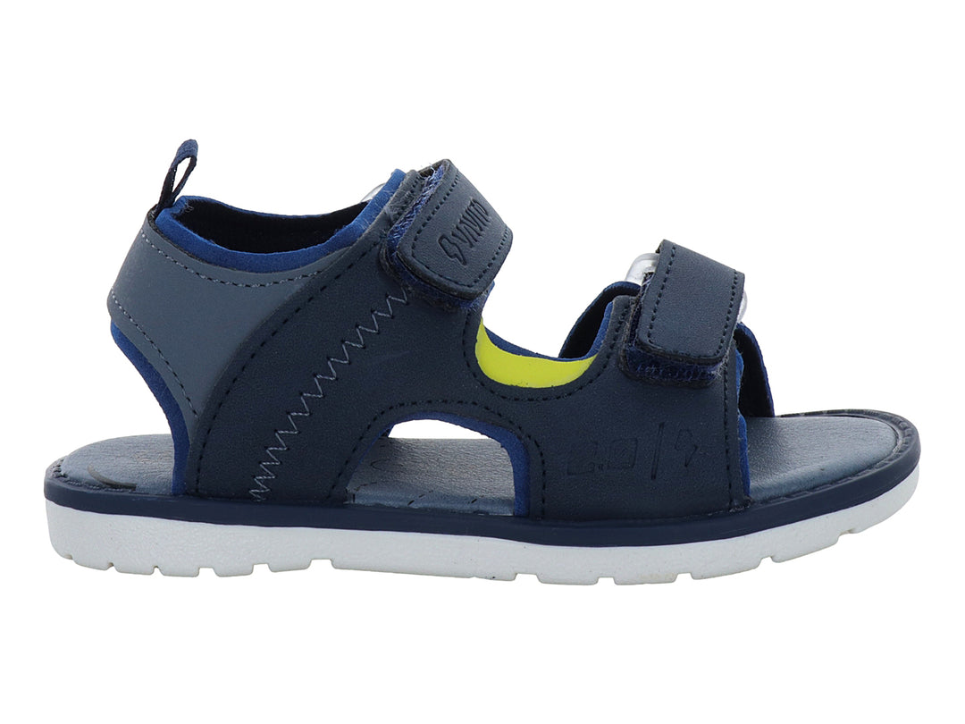 Sandalia infantil color azul marino con suela blanca y cierres de velcro.