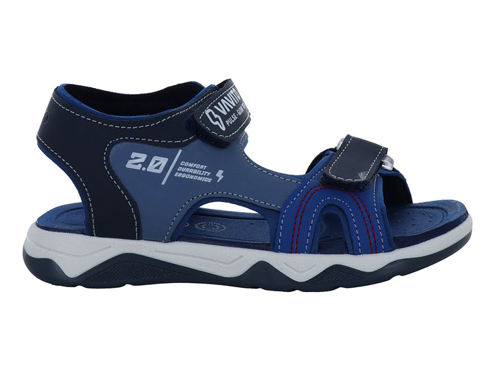 Sandalia deportiva para niño color azul rey con suela blanca y correas de ajuste con velcro.