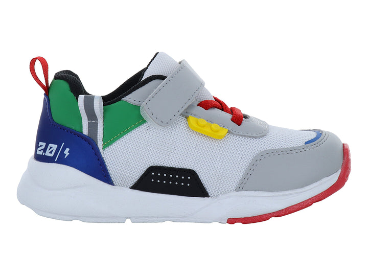 Zapato deportivo infantil VAVITO en color blanco con detalles multicolores en azul, verde y rojo con cierre de velcro.