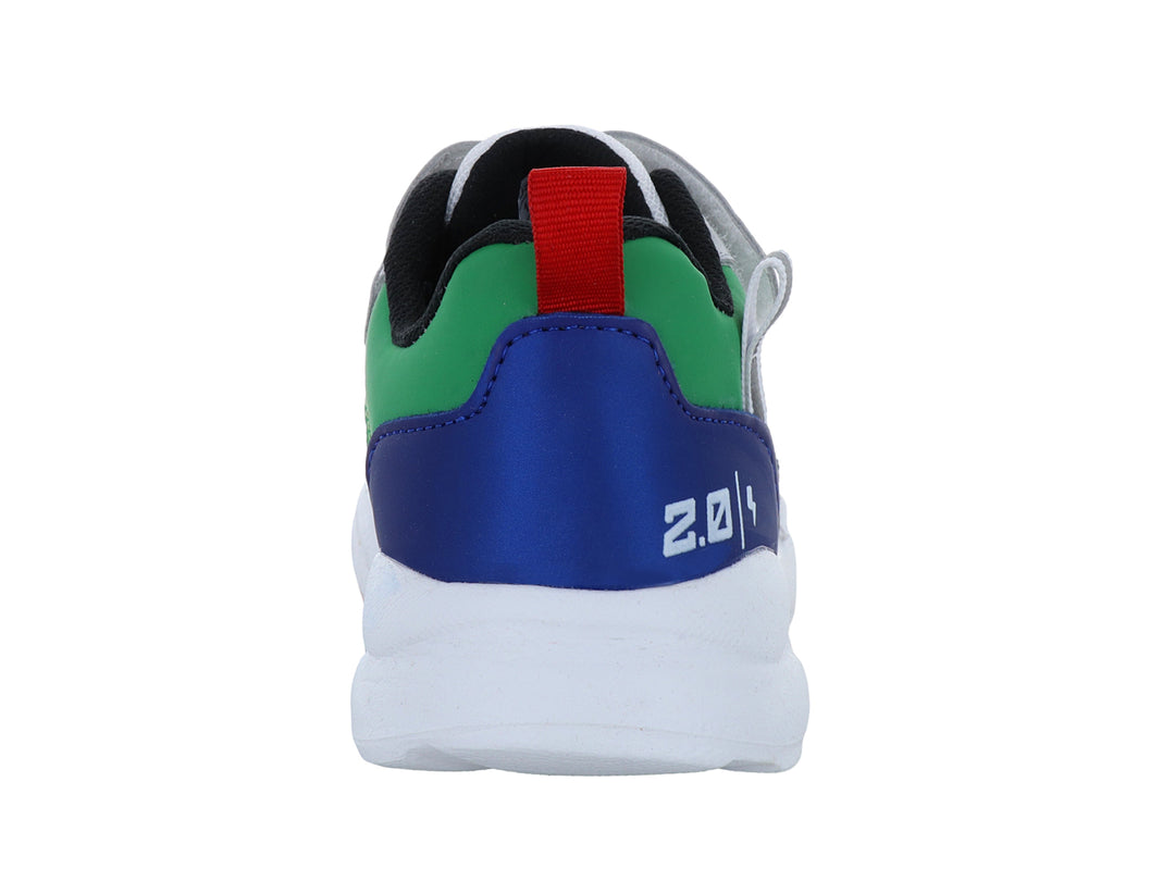 Zapato deportivo infantil VAVITO en color blanco con detalles multicolores en azul, verde y rojo con cierre de velcro.