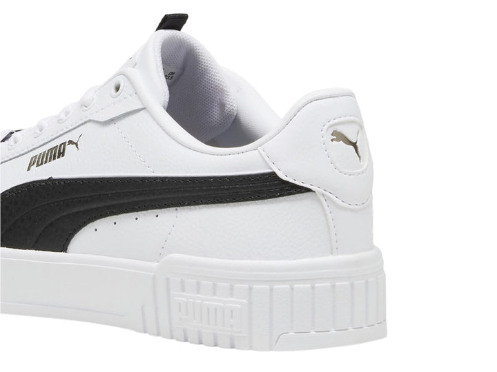 Tenis PUMA Carina 2.0 Lux color blanco con franja negra lateral y suela de plataforma blanca.