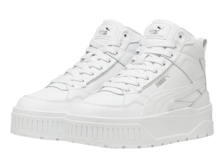 Tenis PUMA blancos de corte medio con suela de plataforma gruesa.