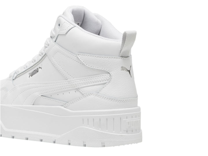 Tenis PUMA blancos de corte medio con suela de plataforma gruesa.