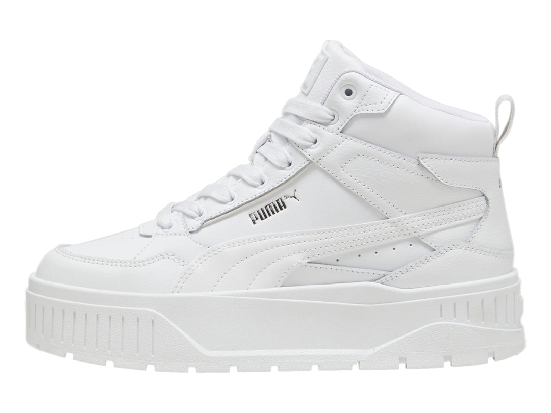 Tenis PUMA blancos de corte medio con suela de plataforma gruesa.