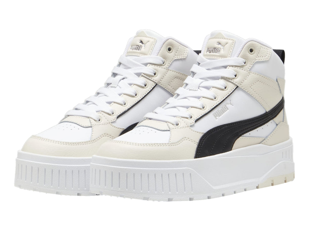 Tenis PUMA Karmen II Idol Mid en color blanco y negro con suela de plataforma elevada.