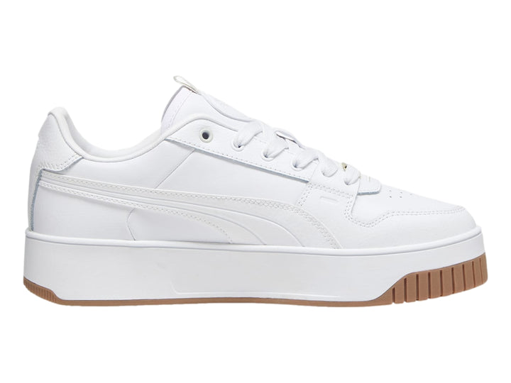 Tenis PUMA blancos de plataforma con suela color marrón.