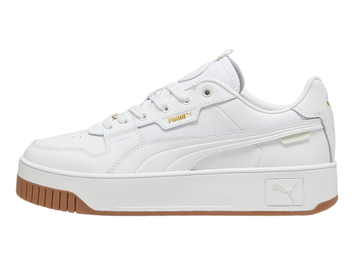 Tenis PUMA blancos de plataforma con suela color marrón.
