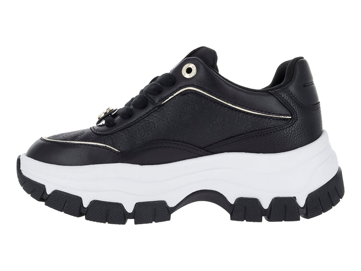 Tenis Guess negros con suela blanca de plataforma y detalles dorados.