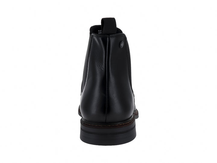 Botín negro de cuero estilo Chelsea con panel elástico lateral y costuras cafés en la suela.