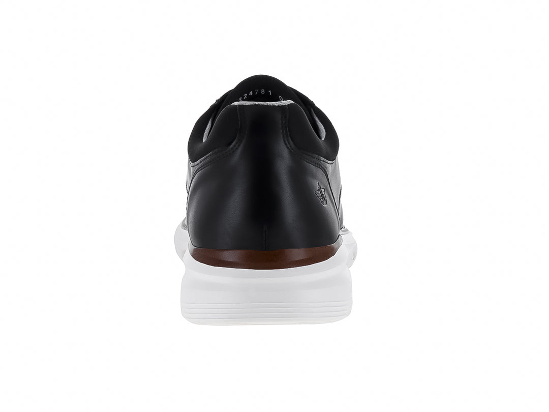 Zapato casual Dockers color negro con suela blanca y una línea decorativa en color café.