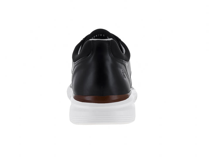 Zapato casual Dockers color negro con suela blanca y una línea decorativa en color café.