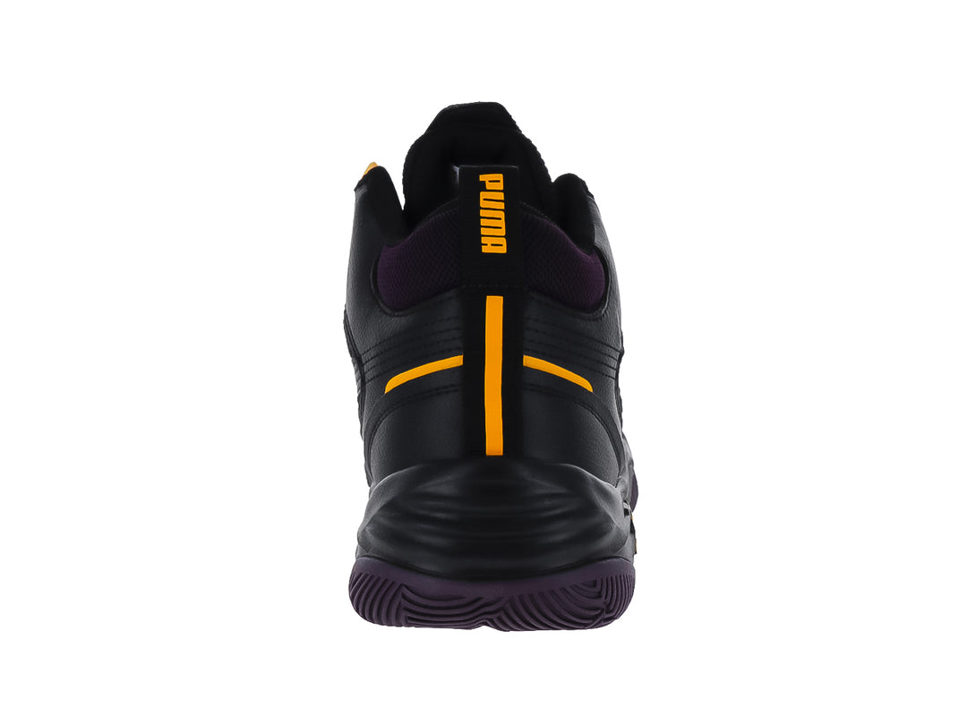 Tenis PUMA Rebound Future Nextgen color negro con suela morada y detalles en naranja.