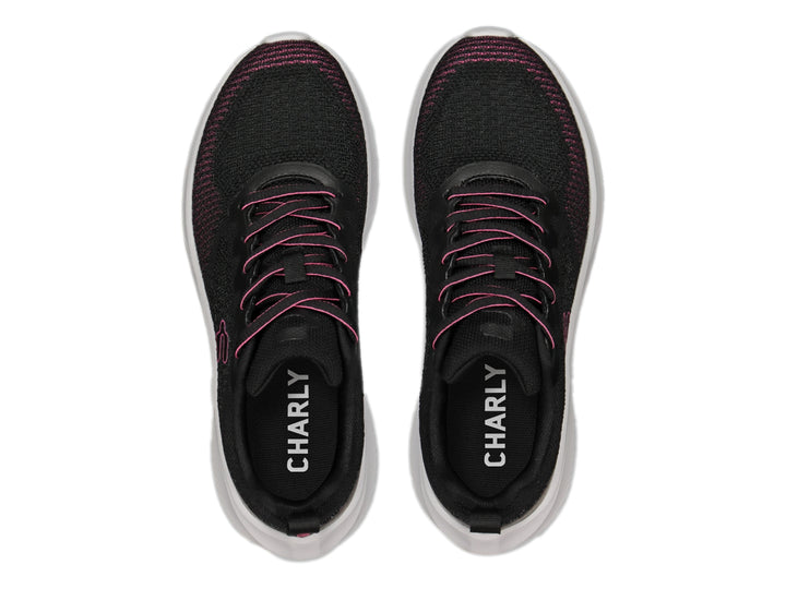 Tenis deportivos Charly color negro con detalles en fucsia y suela blanca.