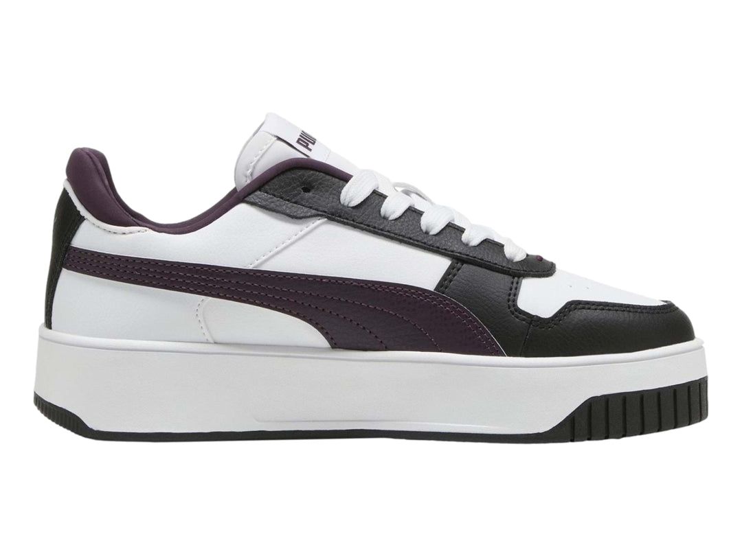 Tenis PUMA Carina Street en color blanco con detalles en morado y negro, con suela de plataforma blanca.