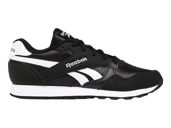 Tenis deportivos Reebok color negro con franjas y suela blanca.
