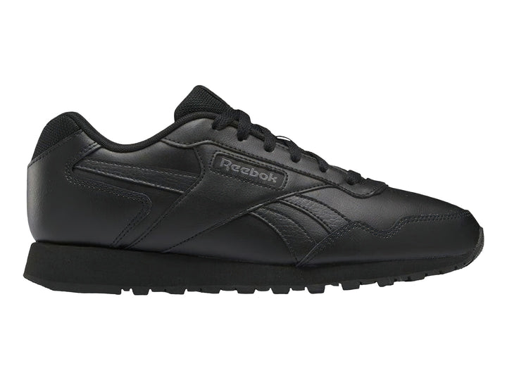 Tenis deportivos Reebok color negro con suela negra y logotipo lateral.