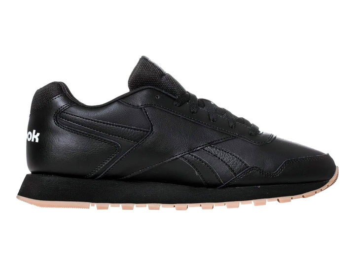 Tenis deportivos Reebok color negro con suela beige y logotipo blanco.