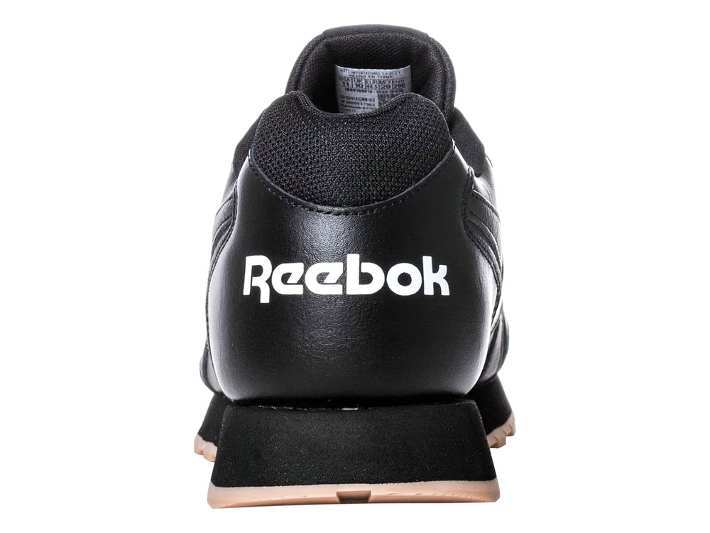 Tenis deportivos Reebok color negro con suela beige y logotipo blanco.