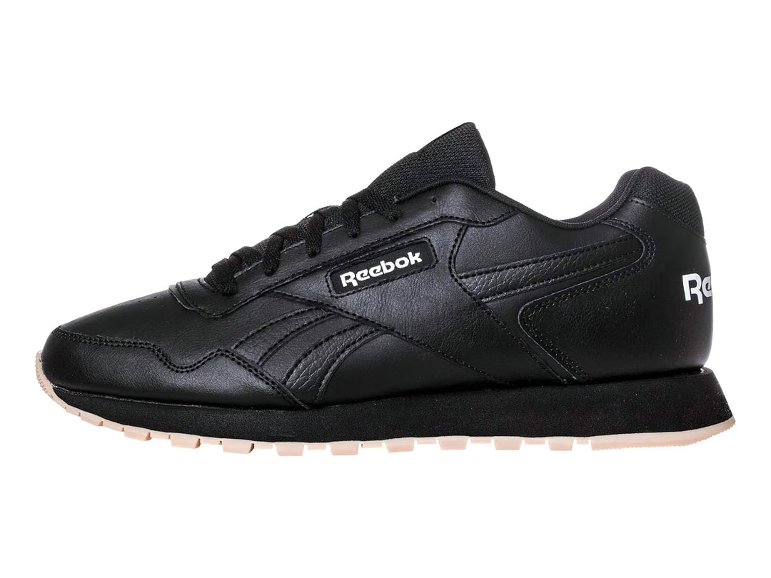 Tenis deportivos Reebok color negro con suela beige y logotipo blanco.
