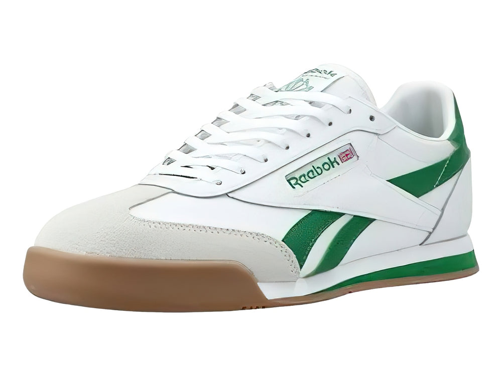 Tenis Reebok blancos con franjas verdes y suela color café.