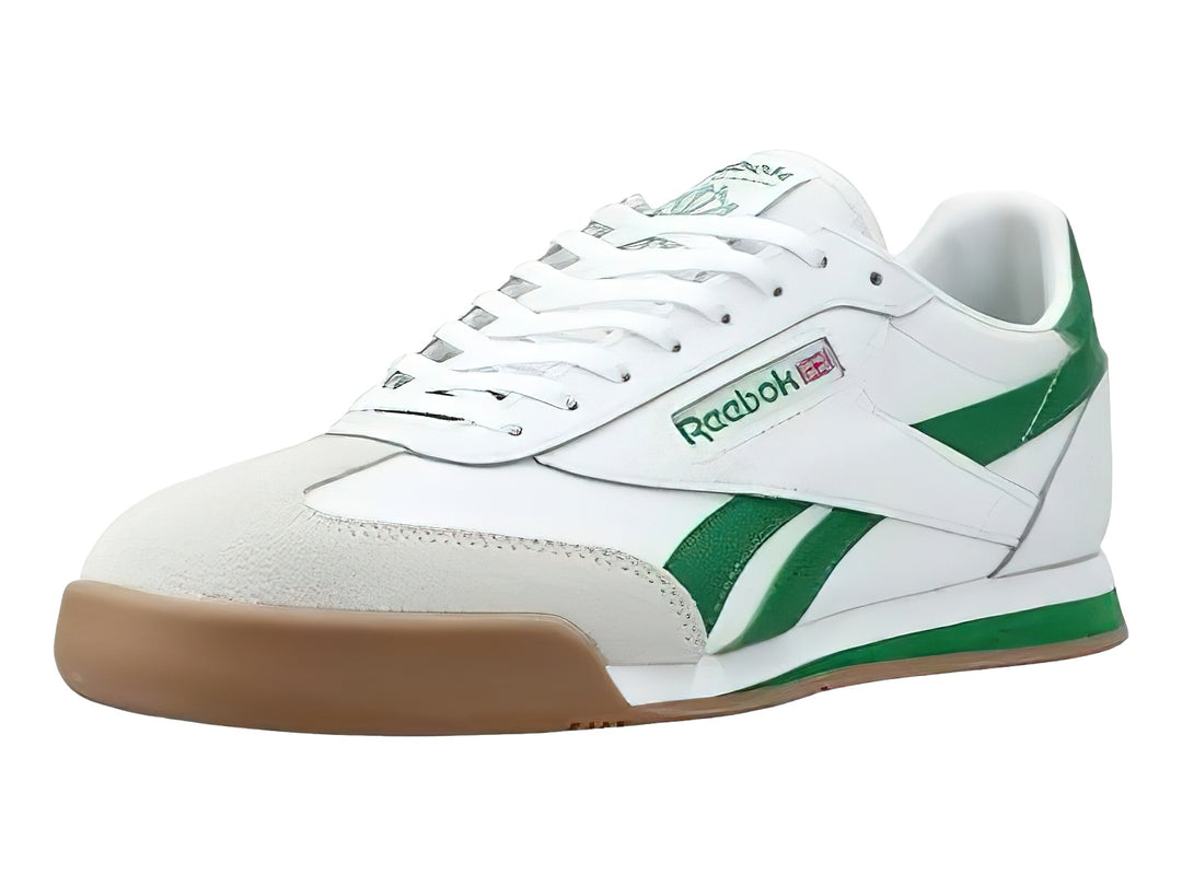 Tenis Reebok blancos con franjas verdes y suela color café.