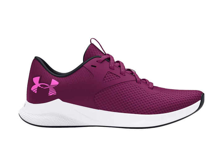 Zapato deportivo Under Armour color morado con suela blanca y detalles en malla.